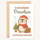 Christmas card for a grandson with a penguin holding a gift and a small tree, surrounded by snowflakes.